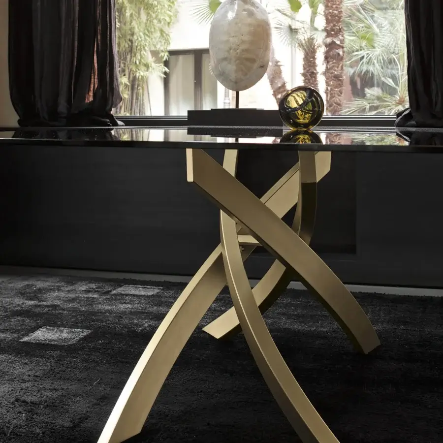 Distinguished Bontempi Artistico table with a glossy black top and interwoven curved legs crafted in matte gold finish
