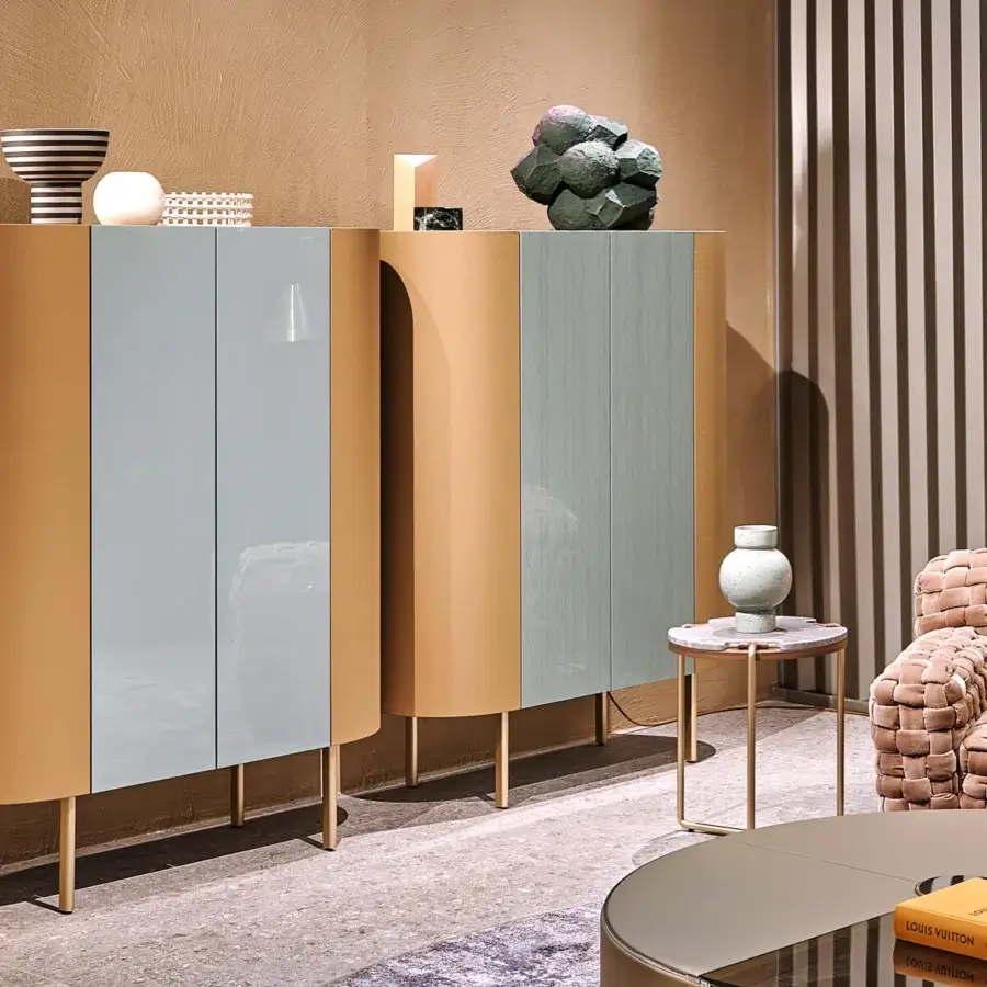 Elegant Turri Roma cupboard with curved golden-tan leather and glossy light blue-grey lacquered paneled doors offering glass shelving
