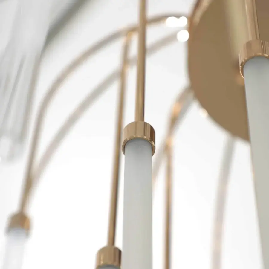 Distinguished Stillux Line ceiling lamp with a glossy gold metal structure and thirty curved arms supporting tubular frosted pyrex glass diffusers
