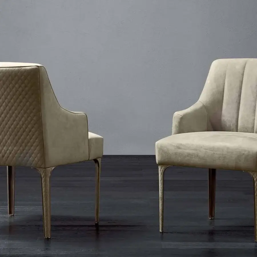 Exceptional Rugiano Arianna armchair upholstered in light beige textile with steel legs and matelassé leather accents