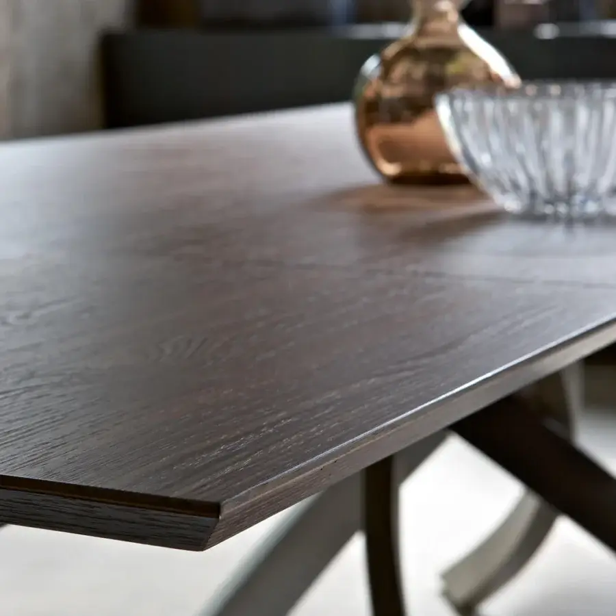 Superior Bontempi Artistico table with a dark brown wood surface and arched metal base exhibiting a smooth finish