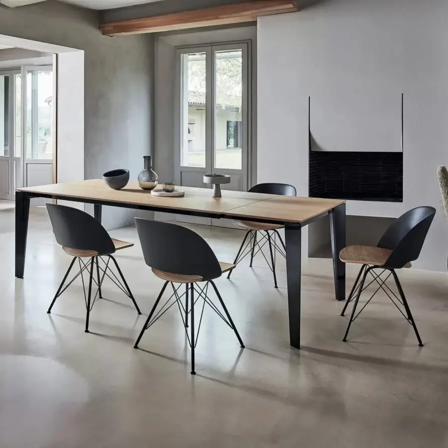 Superior Bontempi Casa Cruz extendable table with a light wooden top and dark matte metal frame and legs