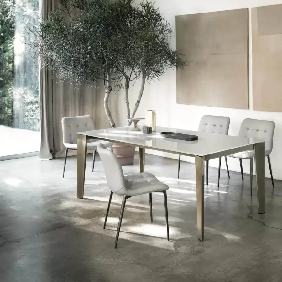 Exceptional Bontempi Cruz extendable table with glossy light-colored glass and brushed metal legs embodying a modern aesthetic