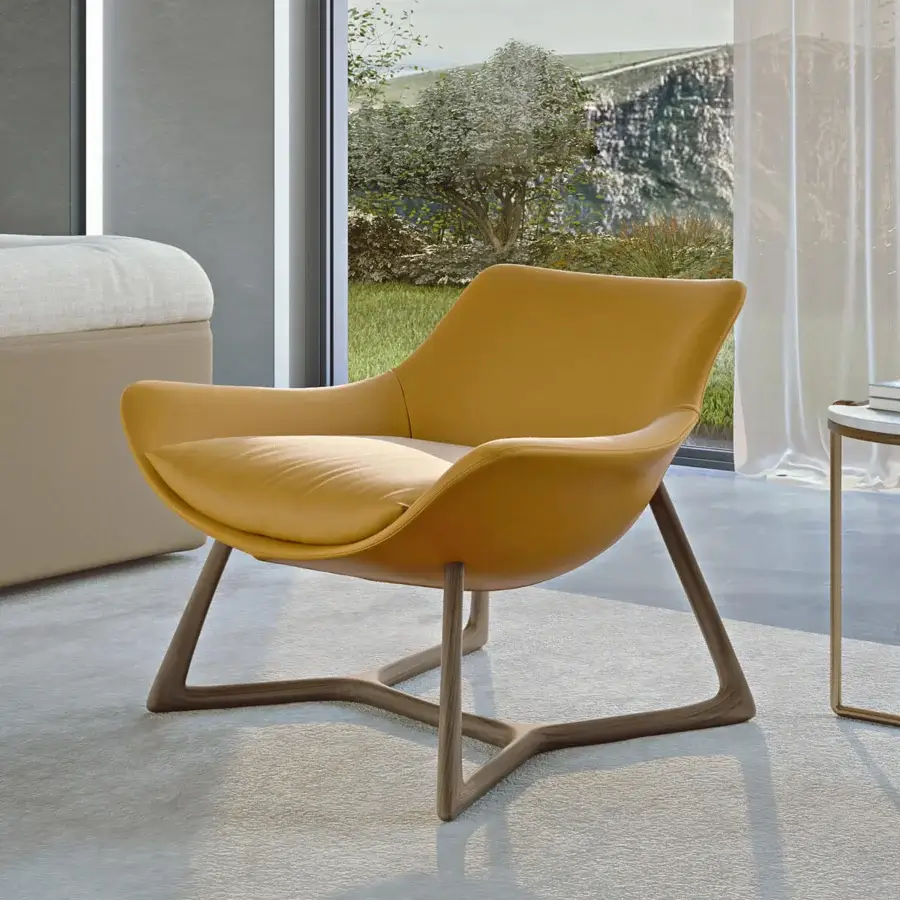 Exceptional Turri Harp Lounge Chair with smooth yellow leather upholstery and solid walnut wood base construction