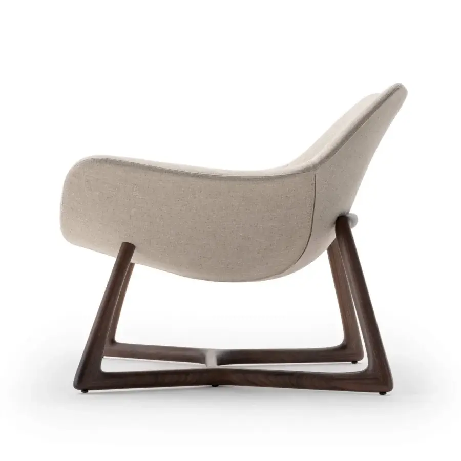 Distinguished Turri Harp Lounge Chair with solid walnut wood base and light beige textile upholstery with a matte finish