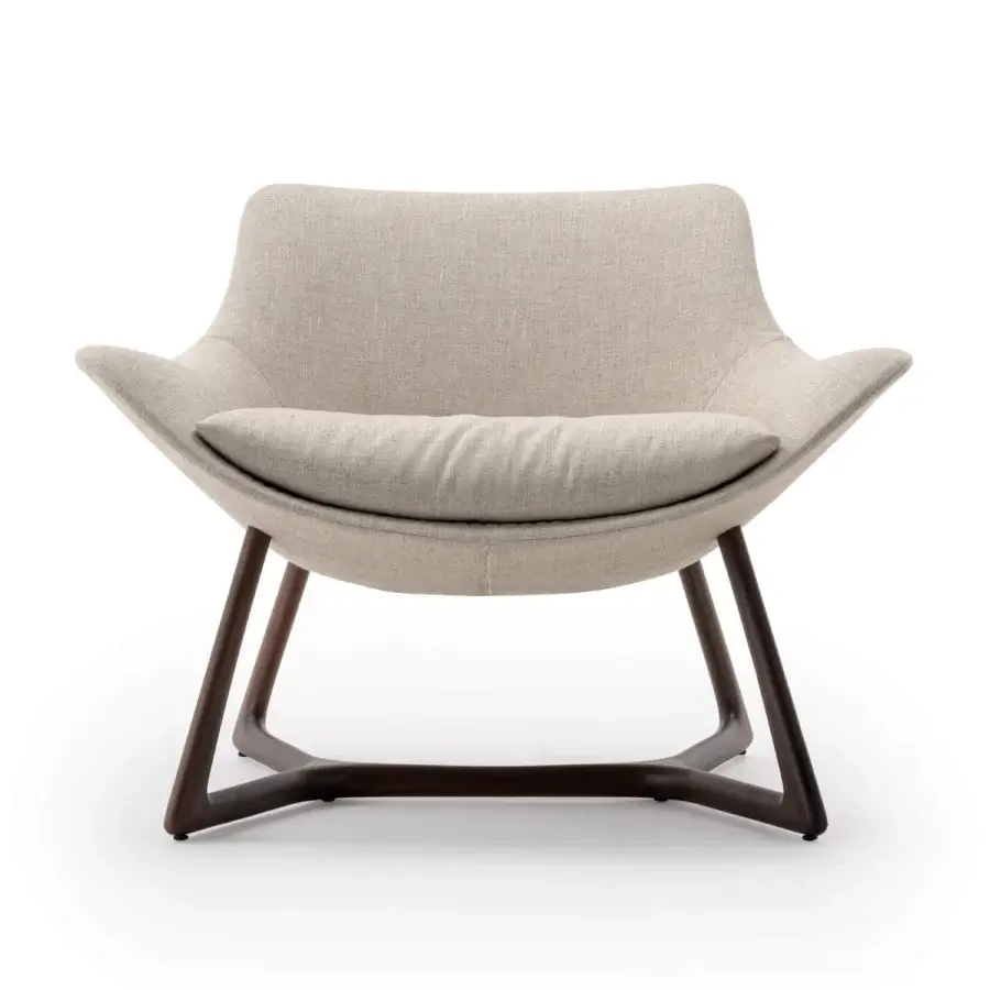 Superior Turri Harp Lounge Chair with curved lines, light beige textile upholstery and a solid walnut wood base