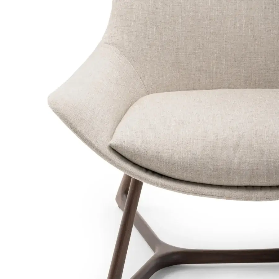 Distinguished Turri Harp Lounge Chair with light beige upholstery and a solid walnut wood base crafted with a dark tone finish