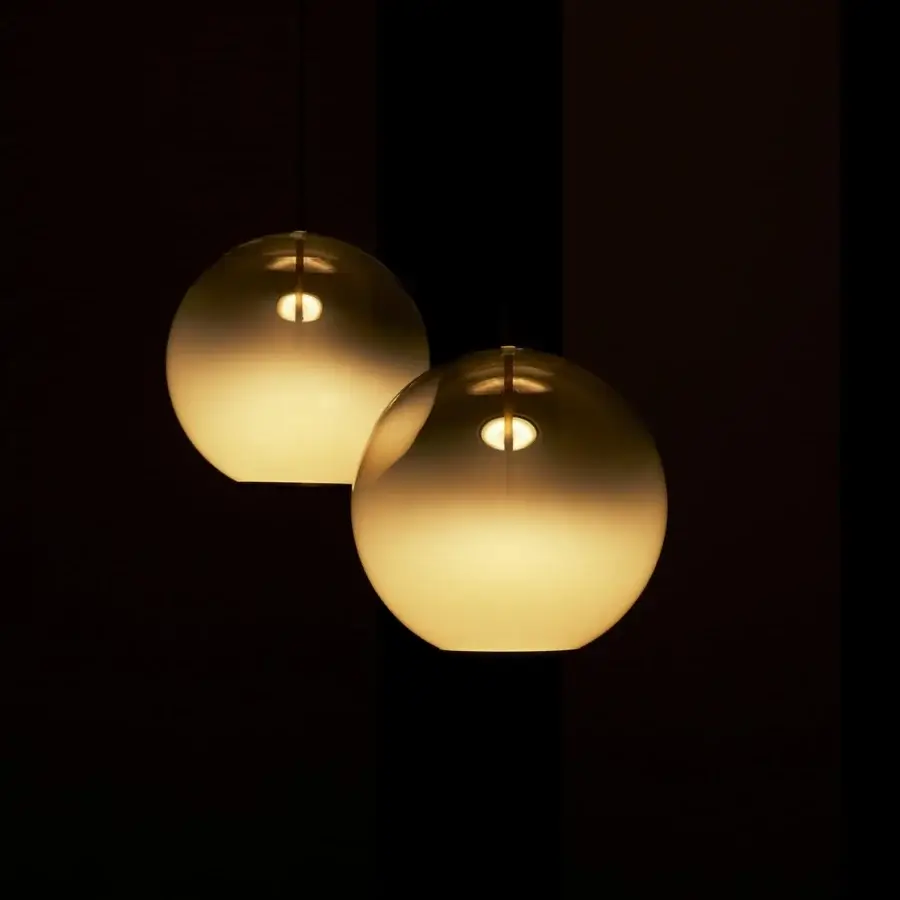 Elegant VENICEM Misty suspension lamp with a spherical form in white blending glass and natural burnished brass structure
