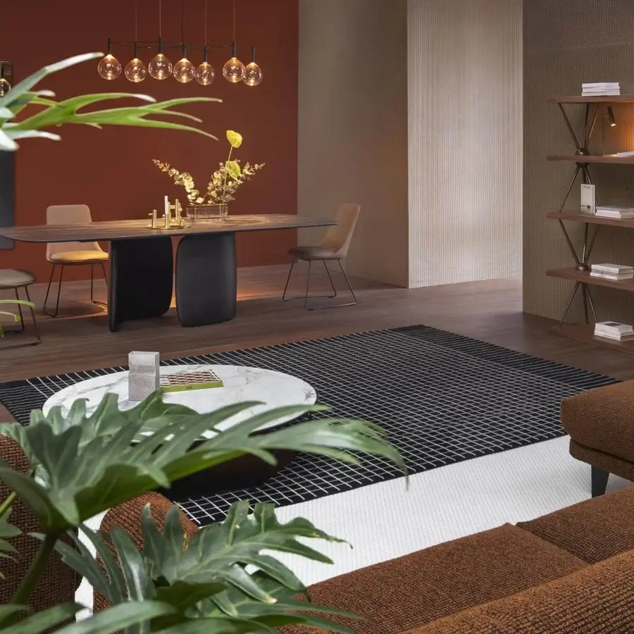 Captivating Bonaldo Itala chair with soft lines upholstered in light beige fabric and dark finished metal legs