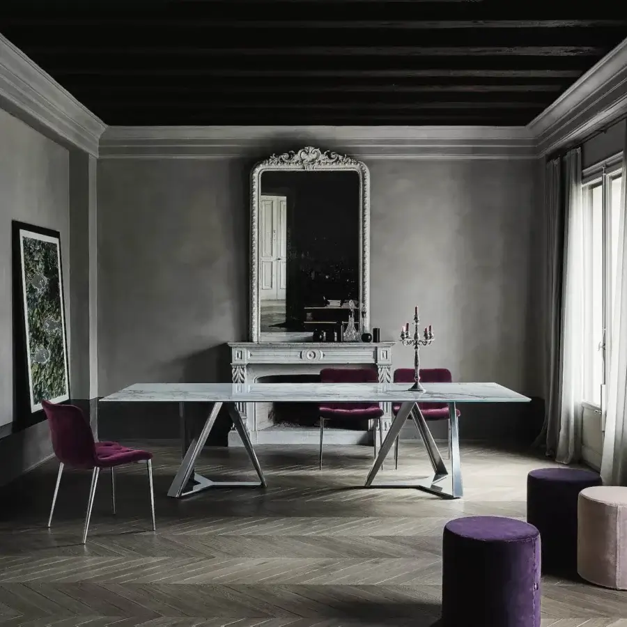 Exclusive Bontempi Millennium table with smooth light-colored tabletop and polished reflective metal interconnected supports