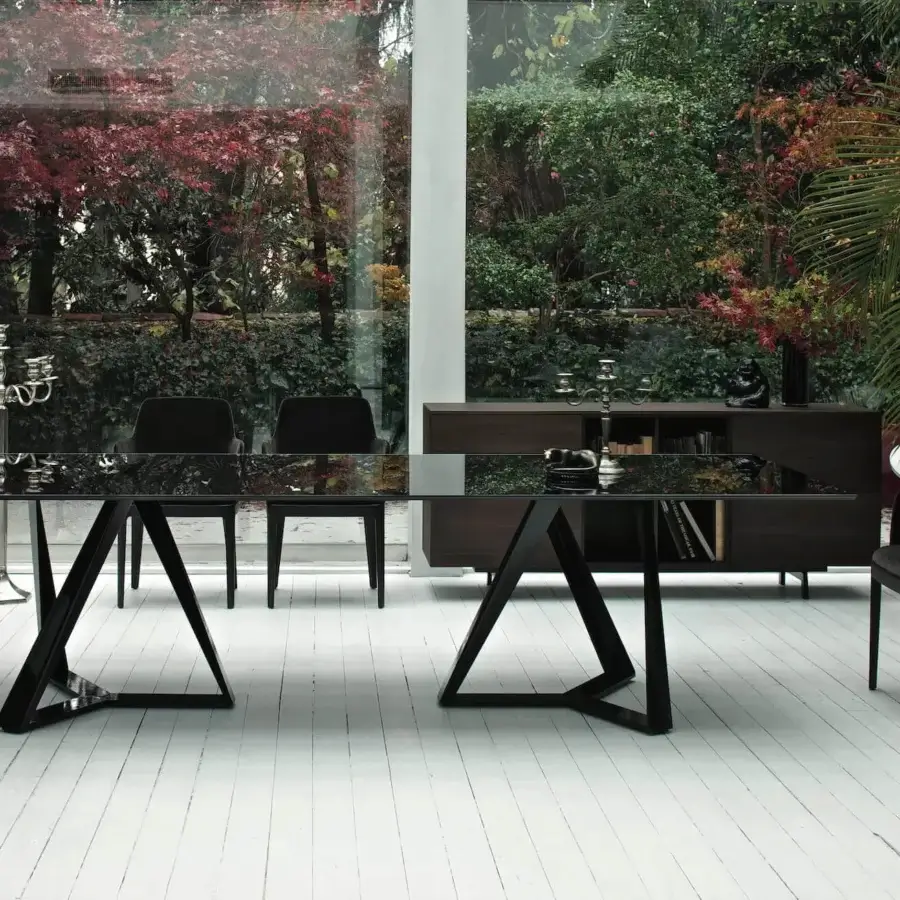 Superior Bontempi Millennium table crafted in Italy with a glossy reflective glass top and sleek dark geometrically-shaped base