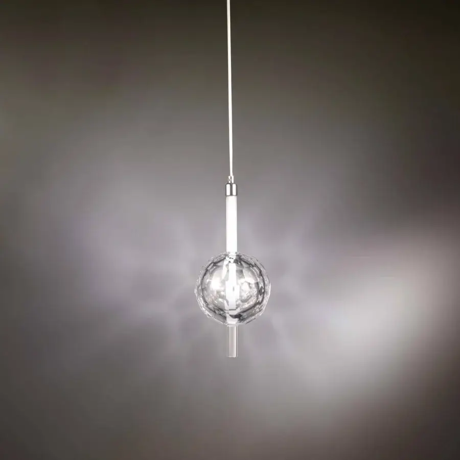 Distinguished Stillux Light suspension lamp crafted in clear lead crystal with a faceted hand polished finish and slender chrome cable