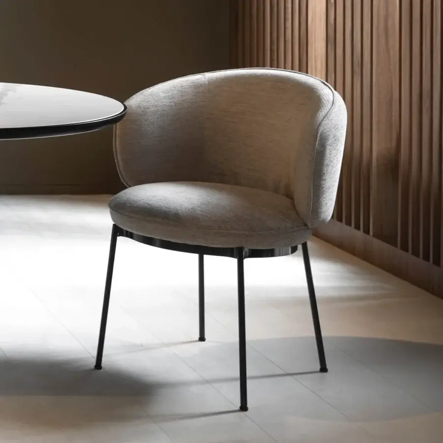 Distinguished Horm Concorde armchair with a fluid form and woven neutral grey textile upholstery upon a matte black metal base