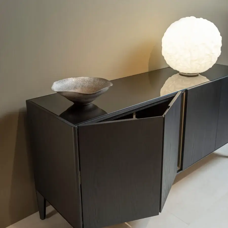 Exceptional Horm Dam sideboard crafted in Italy exhibits black ash wood with a metal perimeter base and folding doors