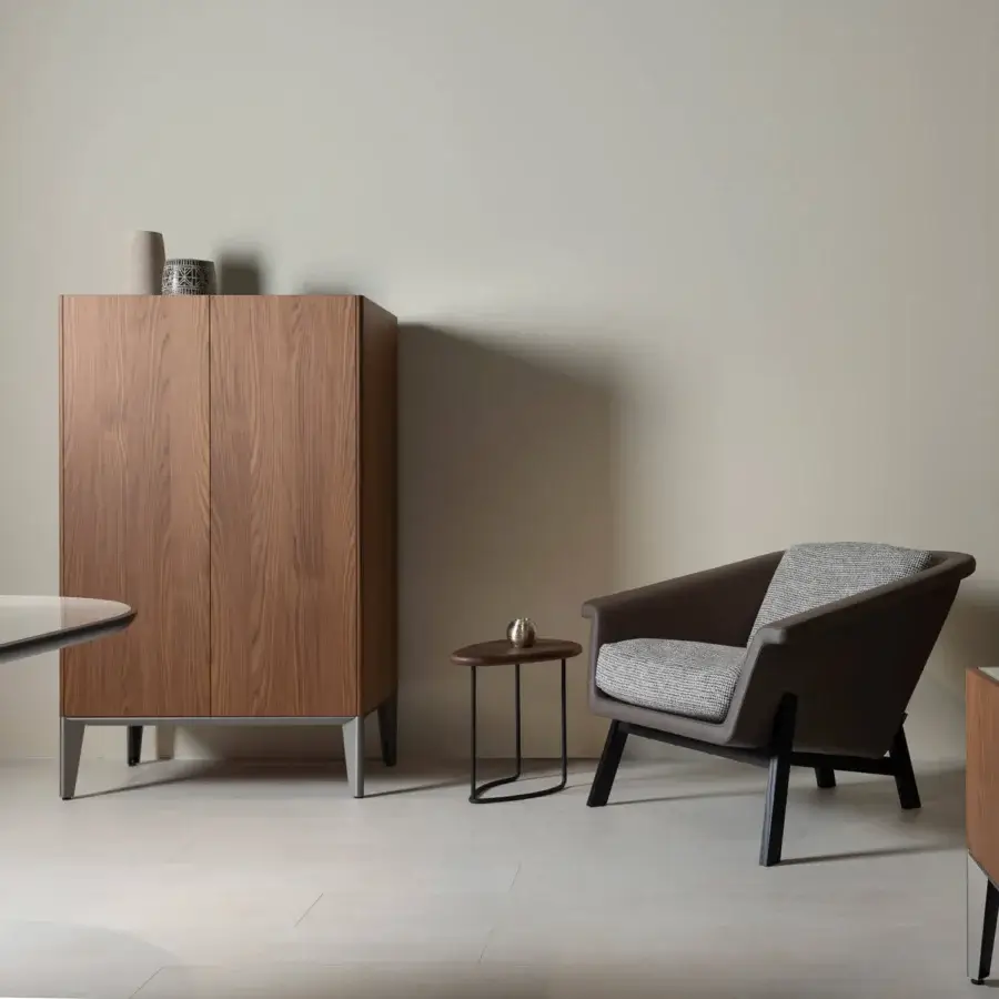 Distinguished Horm Dam cupboard showcases wooden doors in a rich brown finish with a sleek metal base crafted in Italy
