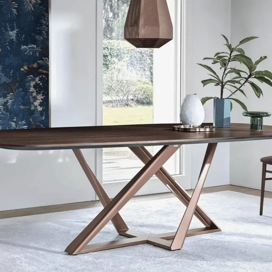 Exceptional Bontempi Millennium Barrel table with a dark brown wood tabletop and intersecting metal supports in a copper tone