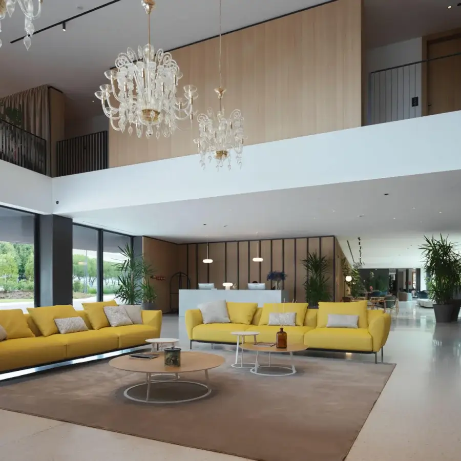 Superior Horm Ella sofa, a seating arrangement upholstered in vibrant yellow textile with thin metal legs