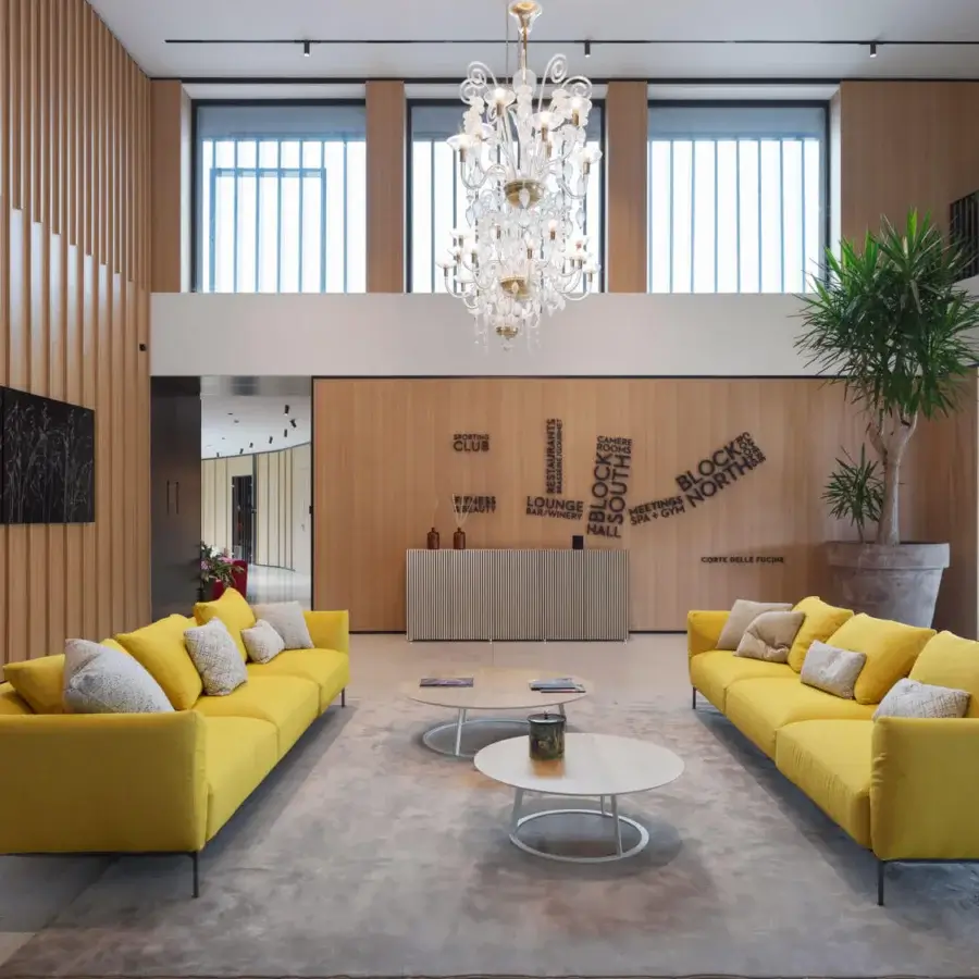 Elegant Horm Ella sofa, a contemporary seating option upholstered in bright yellow textile with a matte finish