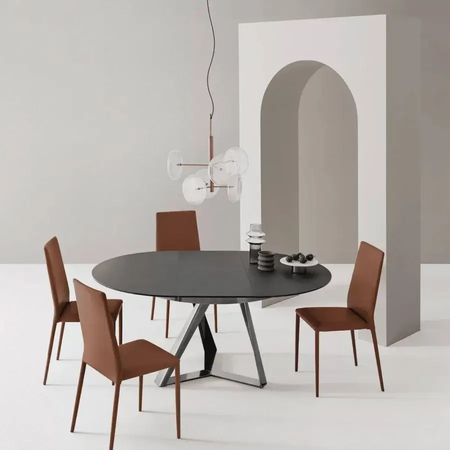 Elegant Bontempi Millennium round extendable table with a dark gray segmented tabletop and sleek metal base crafted with matte finish