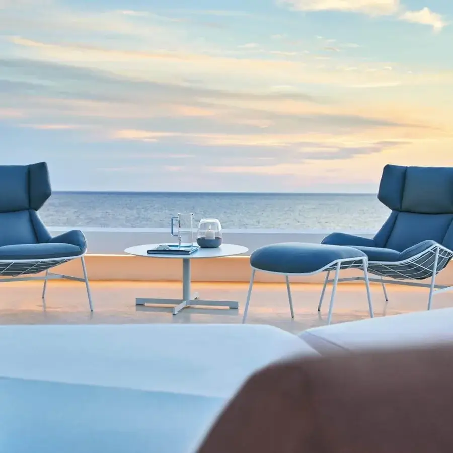 Distinctive Varaschin Summer Set Bergere lounge chair with serene blue textile and light-colored metal frame with matte finish