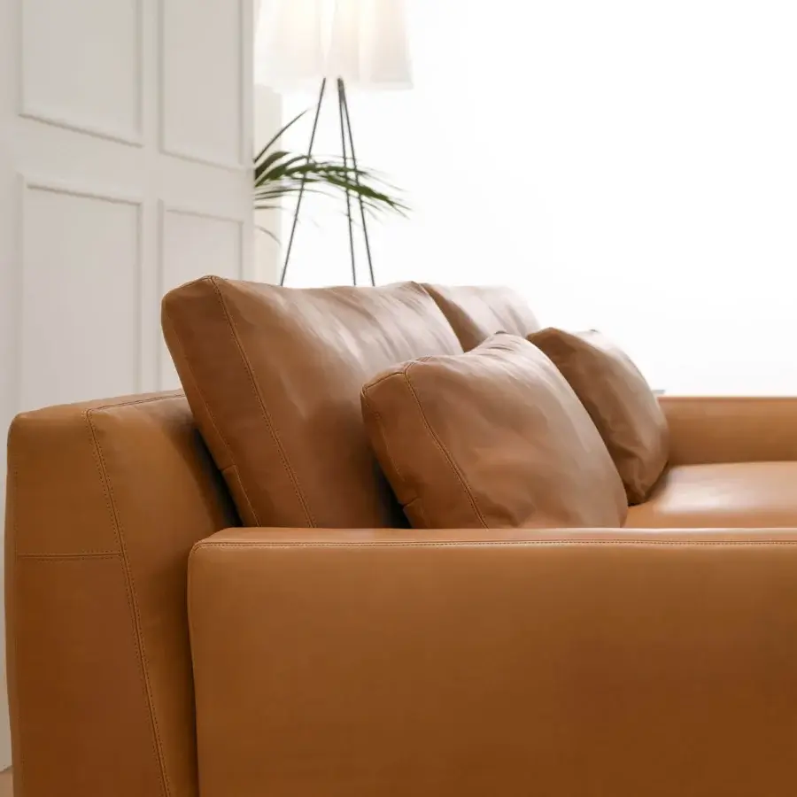 Exceptional Horm Ellington sofa with tan leather-like upholstery and a light aluminum frame exhibiting clean lines
