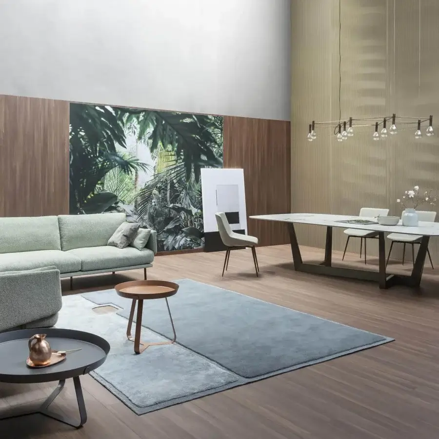 Innovative Bonaldo Art table with dark grey matte ceramic top and angled metal trapezium base