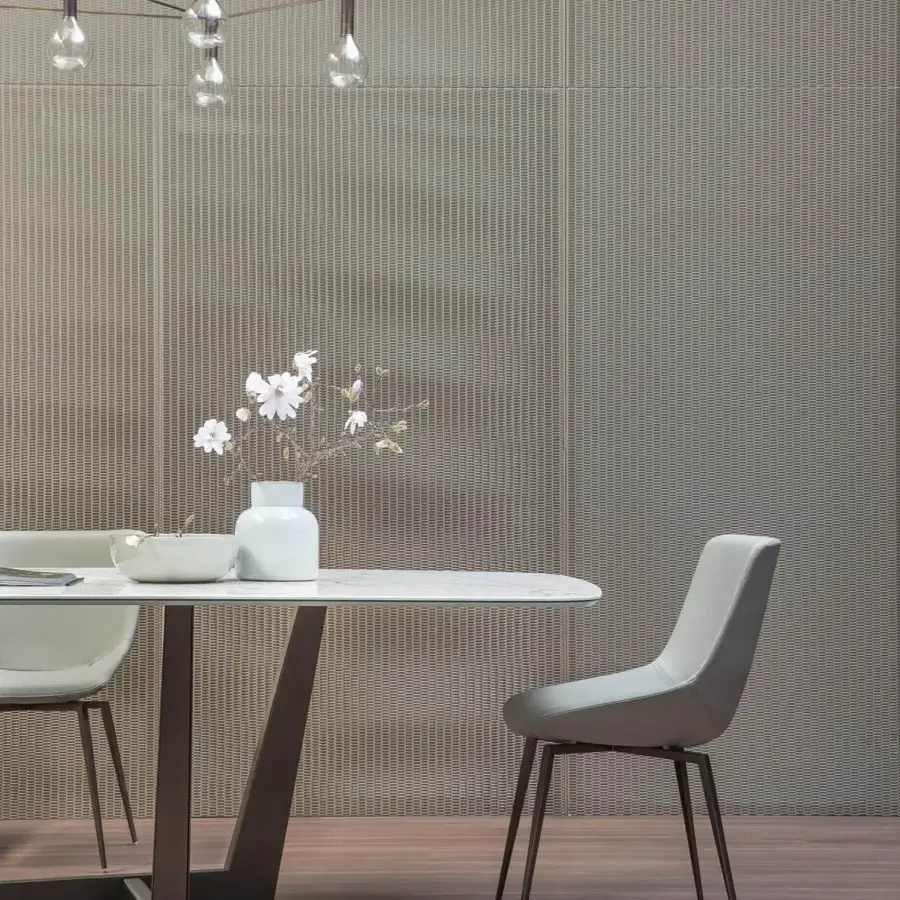 Distinguished Bonaldo Art table with a crisp white tabletop and dark matte-finished trapezoidal metal base crafted in Italy