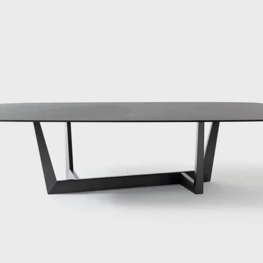 Distinctive Bonaldo Art table with a dark matte top and geometrically intriguing metal trapezium base