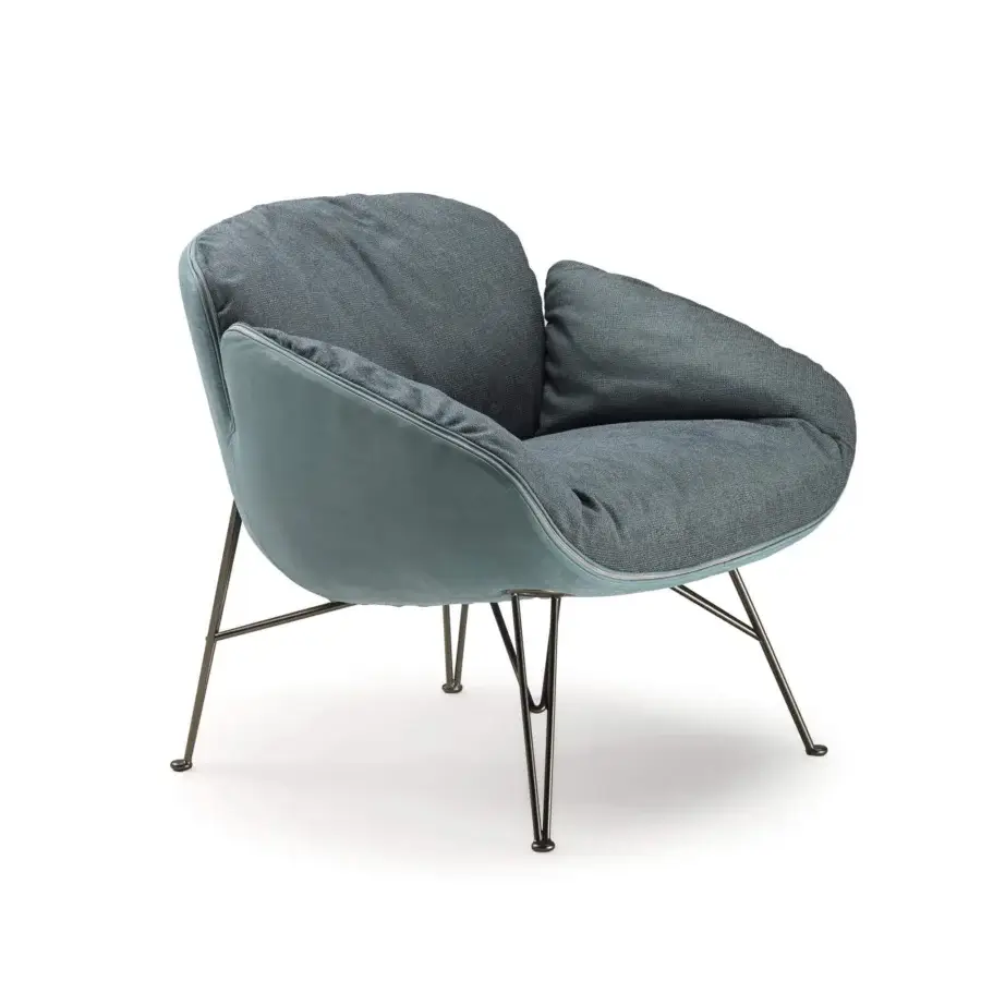 Distinguished Arketipo Juno lounge chair with muted blue-gray woven textile and smooth outer shell finish