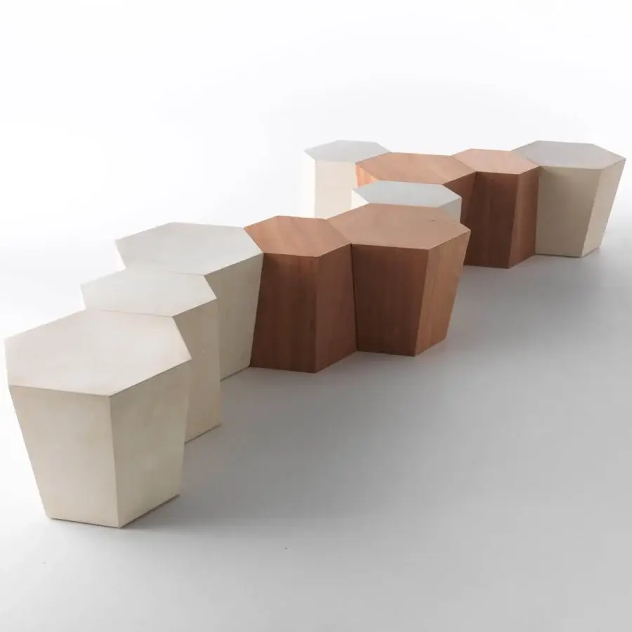 Elegant Horm Hexagon ottoman built with light lecce stone and medium-toned okume wood featuring a satin finish