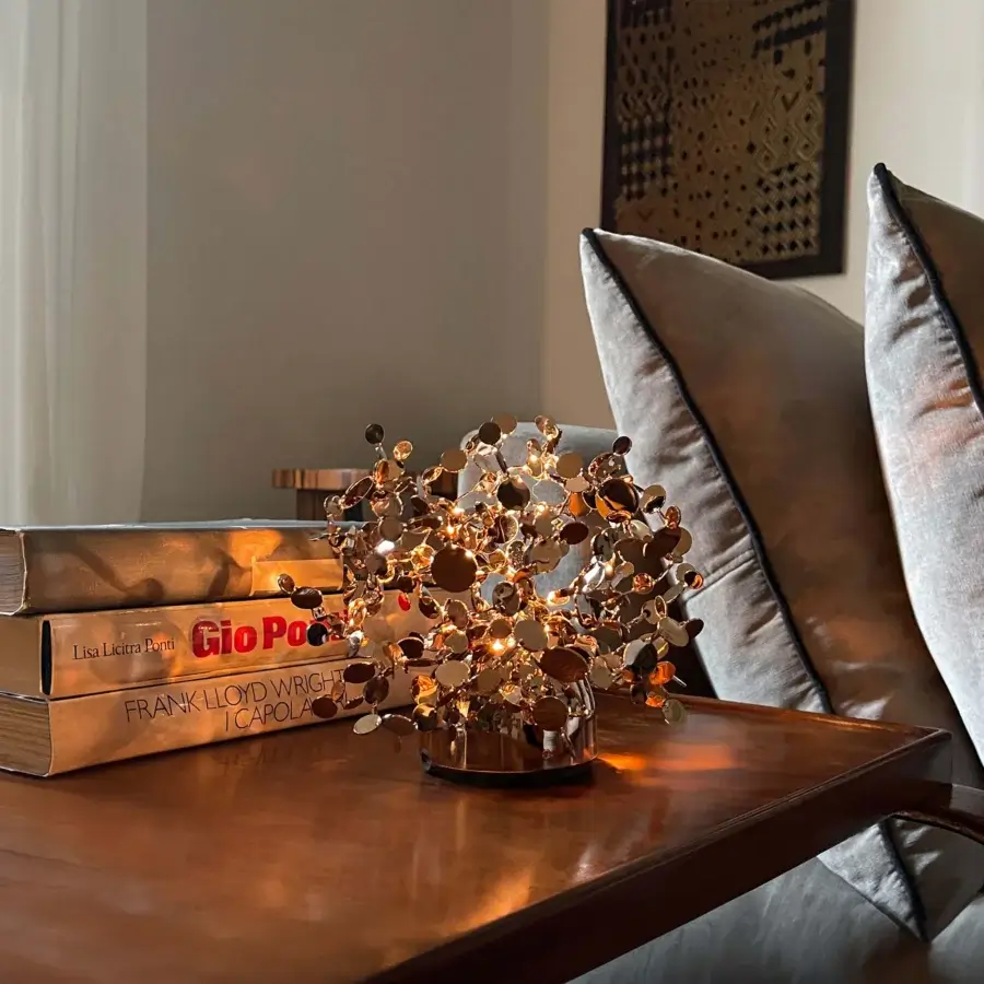 Captivating Terzani Argent Mon Bijou lamp built in Italy with reflective stainless steel discs and warm gold tone