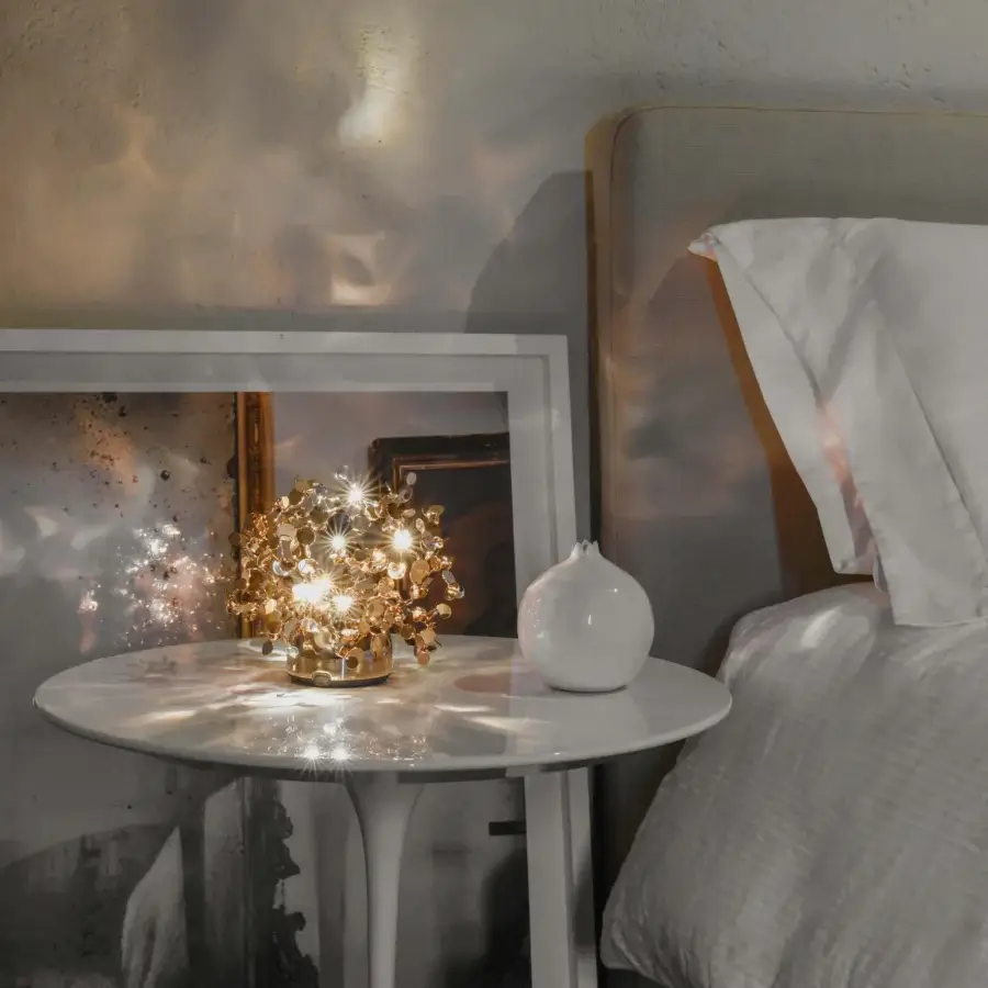 Distinguished Terzani Argent Mon Bijou lamp crafted in Italy with stainless steel and gold-toned metallic discs exhibiting a shimmering finish
