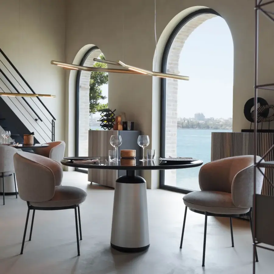 Distinctive Horm Marien table crafted with a dark Fenix tabletop and silver-toned cylindrical base for contemporary elegance