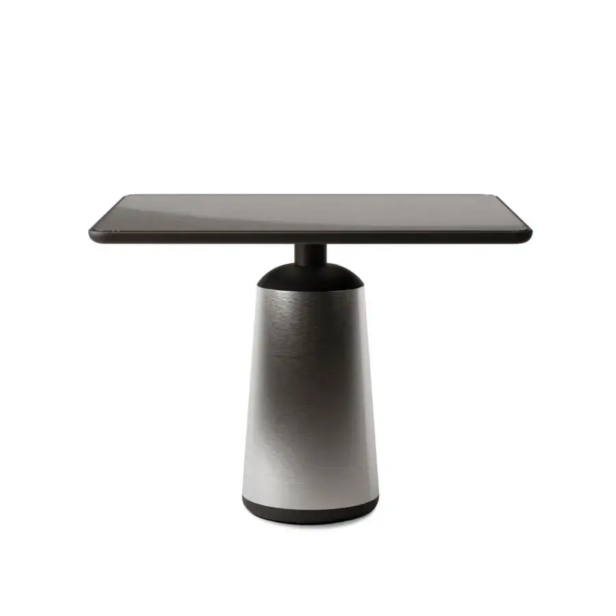 Exceptional Horm Marien table built with dark Fenix tabletop and metallic cylindrical base offering a stunning interplay of light