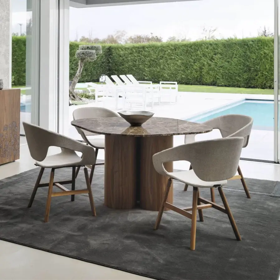 Distinguished Horm Marina table crafted with warm beige marble and brown walnut legs displaying skillful shapes