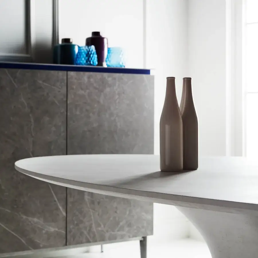 Distinctive Bontempi Podium table with light gray concrete and matte elliptical tabletop presents a modern sculptural form
