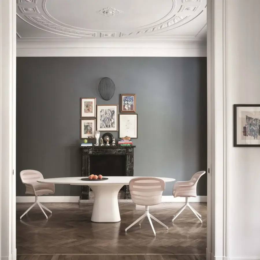 Distinctive Bontempi Podium table with sinuous lines and a matte white tabletop crafted in concrete with a tulip base