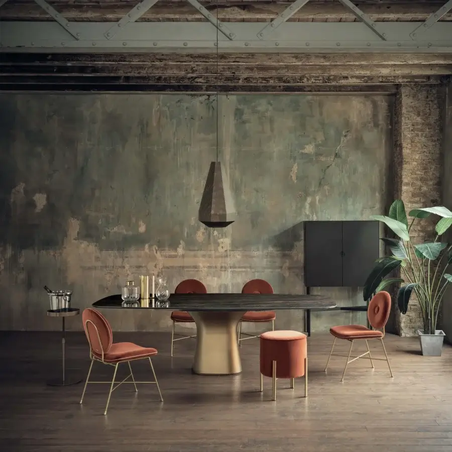 Distinctive Bontempi Podium Barrel table with sinuous lines, glossy dark surface and lustrous metallic gold concrete base