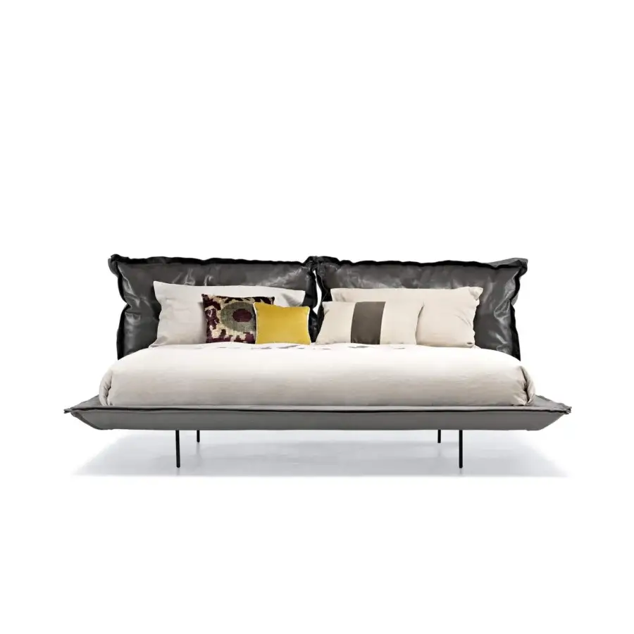 Distinguished Arketipo Auto-Reverse Dream bed with a gray matte textile base and black headboard built with gathered texture