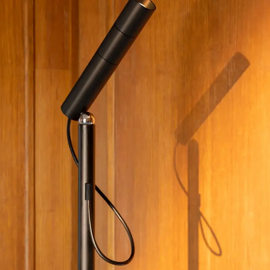 Superior Nemo Lighting floor lamp with a sleek matte black metal form and spherical joint for directional adjustment