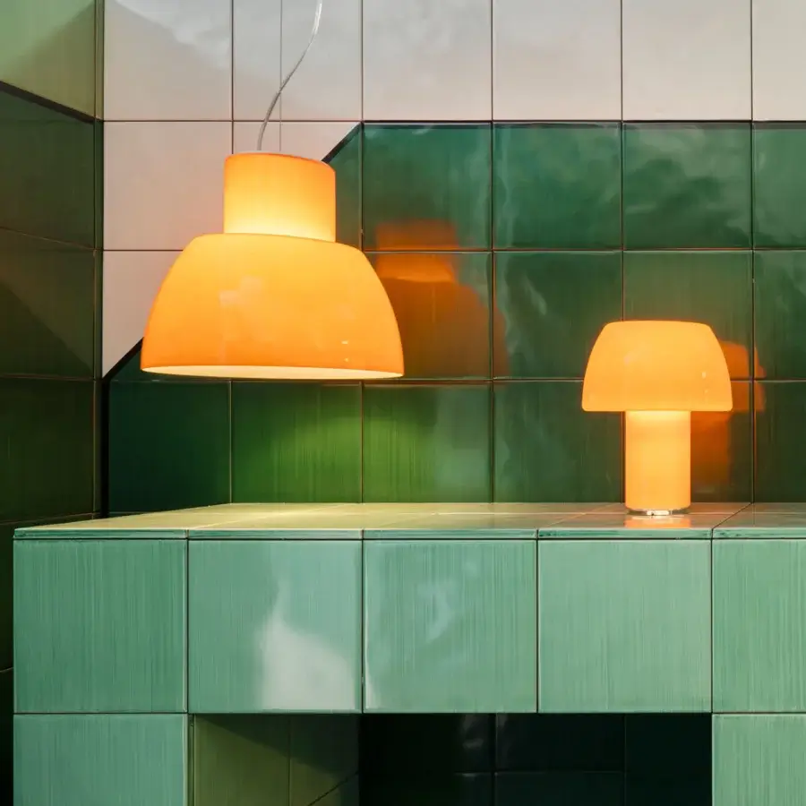 Elegant Nemo Lorosae table lamp with glossy orange glass and a modern mushroom-shaped silhouette