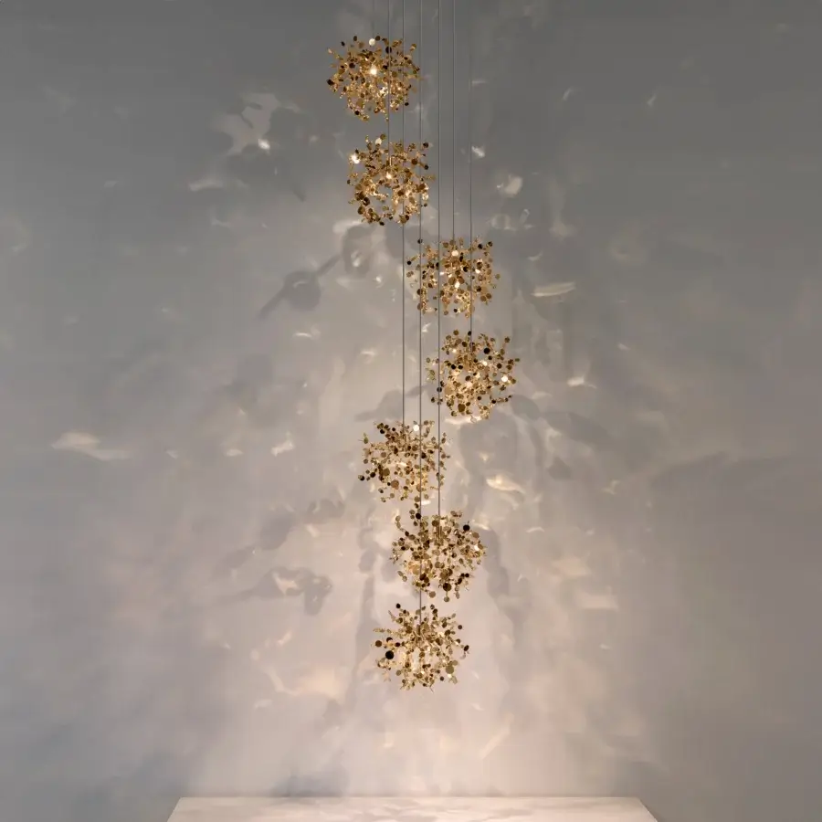 Distinguished Terzani Argent Mon Bijou suspension lamp handcrafted in stainless steel with a gold tone and modular metallic discs