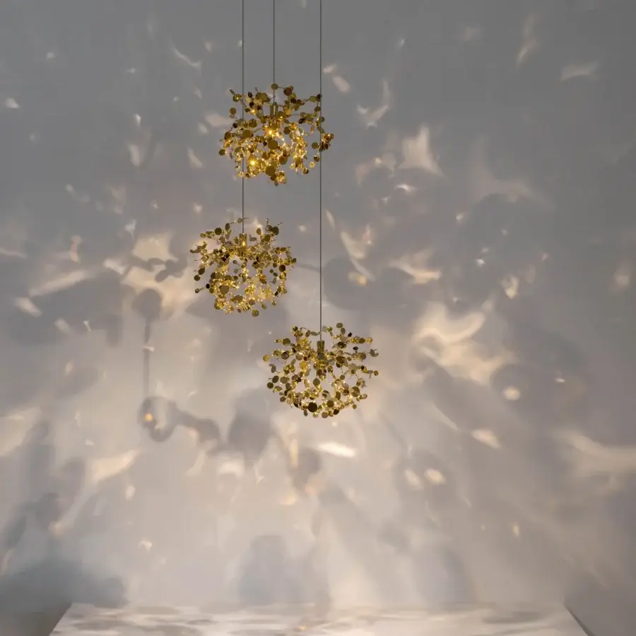 Exceptional Terzani Argent Mon Bijou suspension lamp crafted in stainless steel with gold-toned metallic elements and a shimmering finish