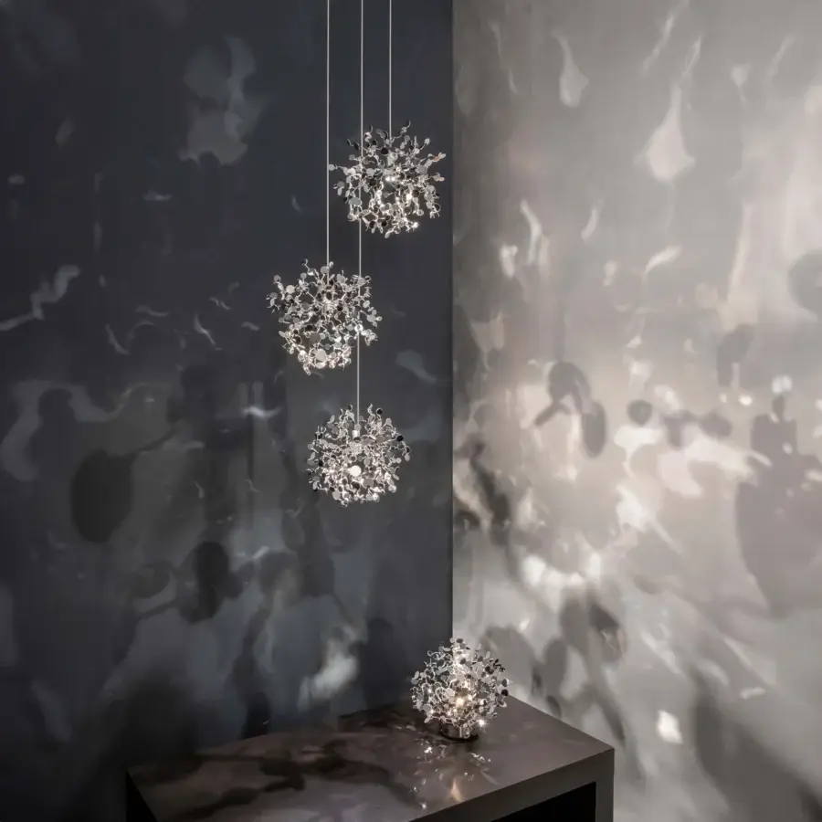 Distinguished Terzani Argent Mon Bijou suspension lamp crafted in stainless steel with reflective metal discs and bright silver finish