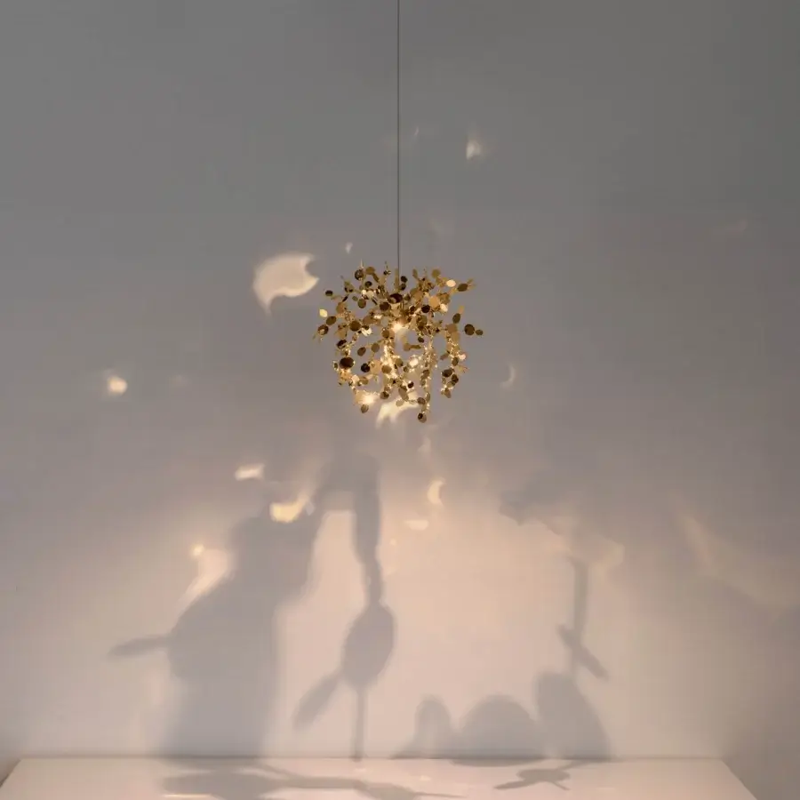 Exceptional Terzani Argent Mon Bijou suspension lamp crafted in lustrous stainless steel casting intricate patterned shadows