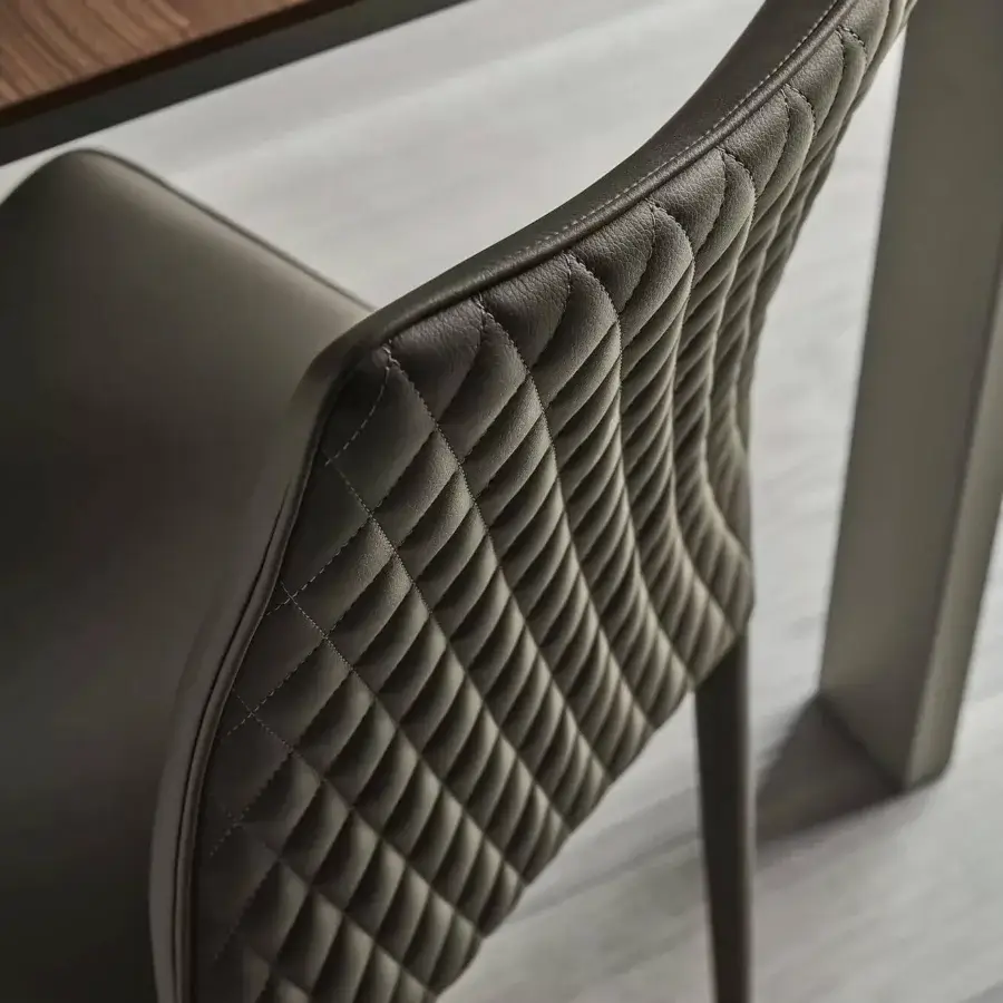 Superior Bontempi Nata chair with quilted dark gray leather-like material and curved ergonomic design