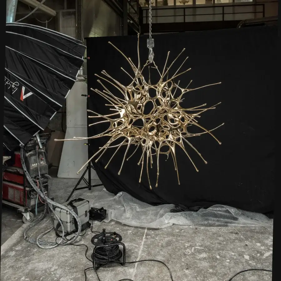 Superior Terzani Dragon suspension lamp handcrafted with liquid metal in a glossy golden finish embodies cosmic harmony