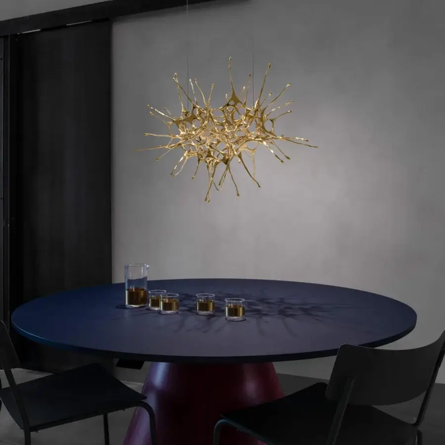 Distinguished Terzani Dragon suspended sculpture handcrafted in glossy gold reflecting light with intricate shadows