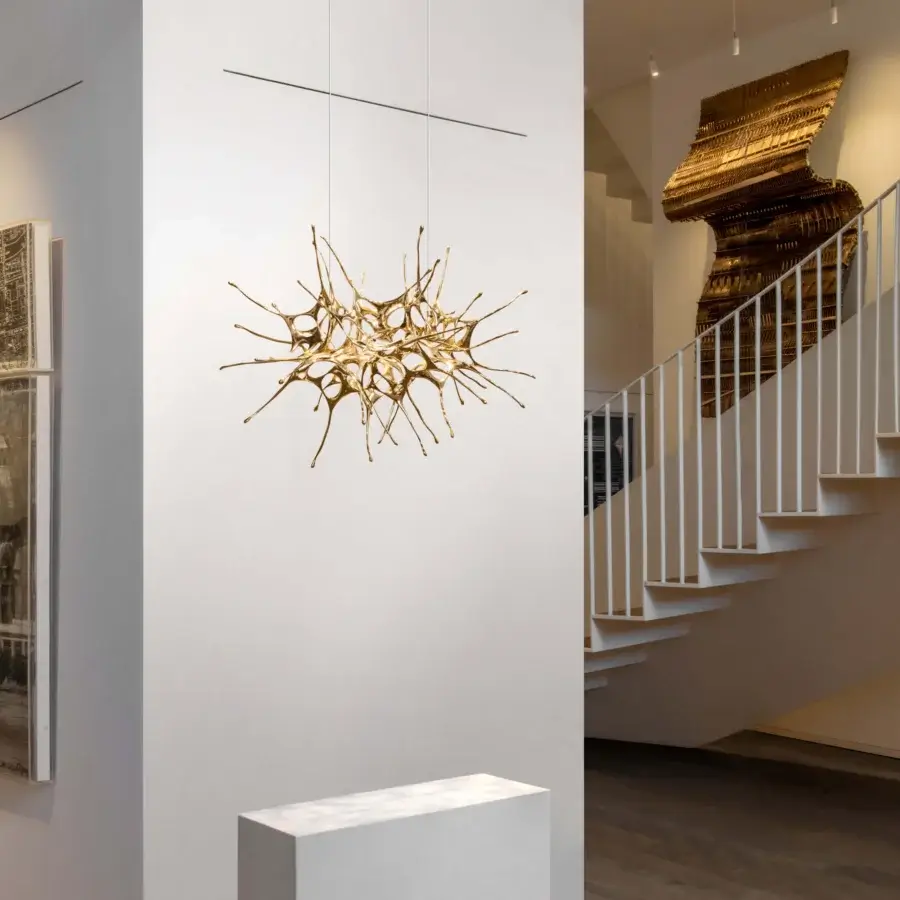 Exclusive Terzani Dragon suspension lamp handcrafted in Italy with interconnected gold-toned extensions radiating from a central core