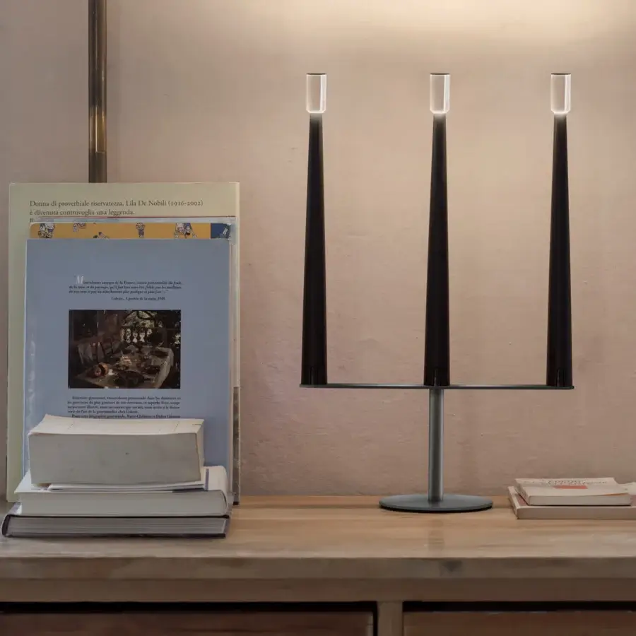 Superior Nemo Lighting Sorrento table lamp with a slender dark metal base and transparent methacrylate diffusers emitting soft light